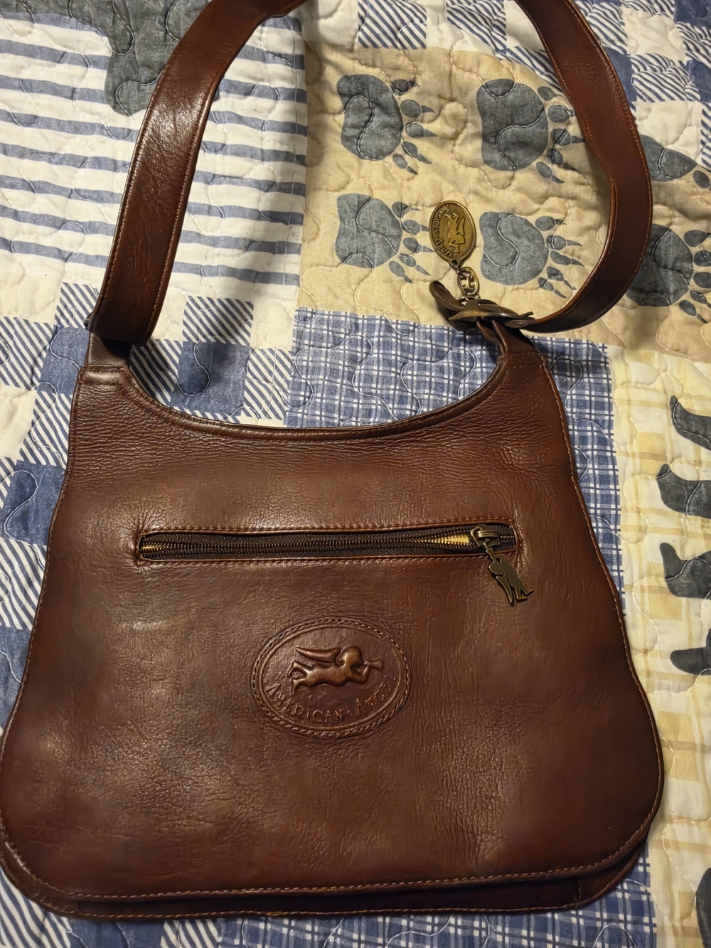 Classic Brown Leather Crossbody Bag with Embossed Medallion